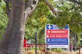 Broome Hospital COVID Clinic sign and a boab tree.