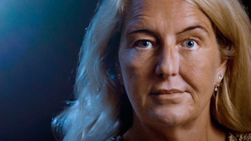 Nicola Gobbo, a woman with blonde hair and blue eyes, looks at the camera.