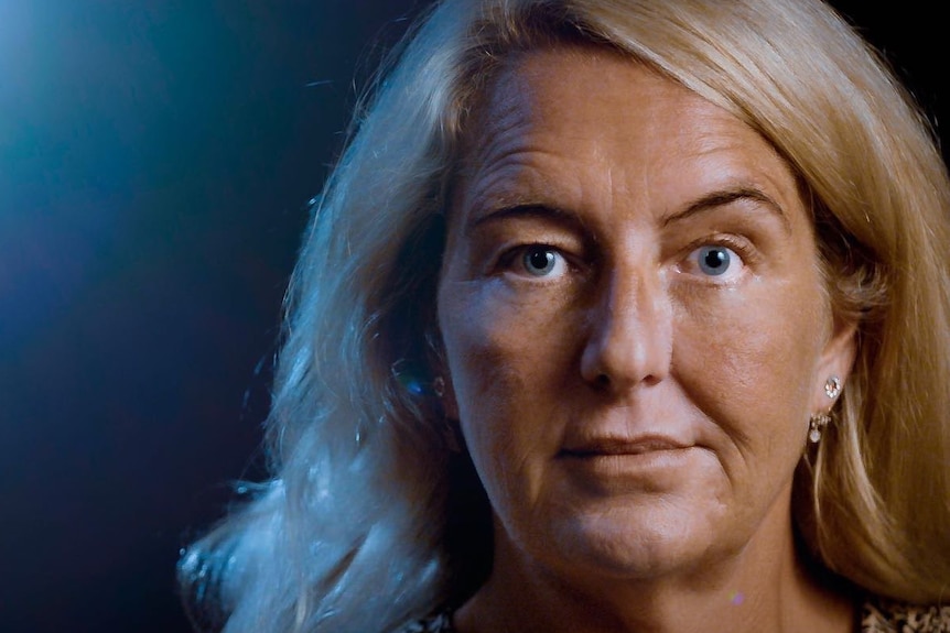 Nicola Gobbo, a woman with blonde hair and blue eyes, looks at the camera.