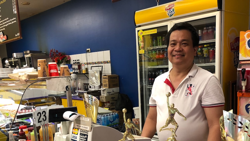 Darwin café owner and basketball coach Ray Langdong with his trophy collection.