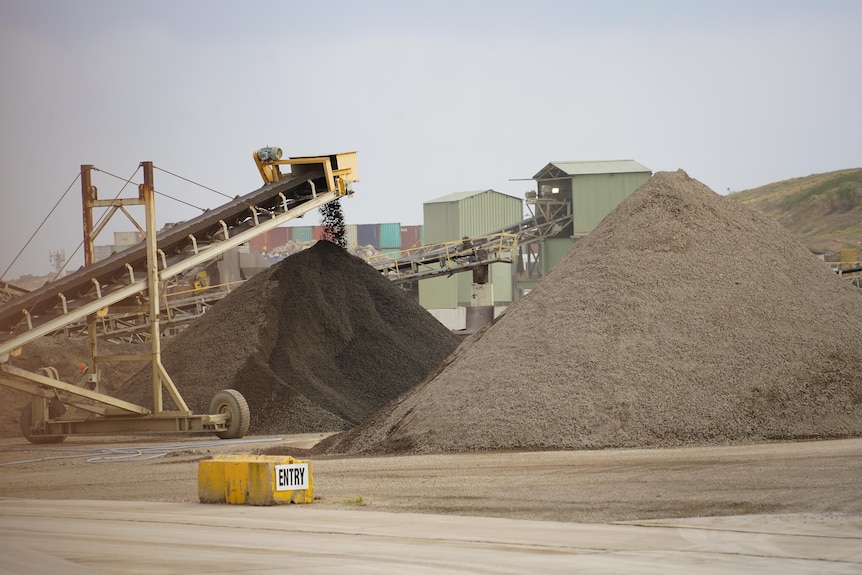 ResourceCo facility with machinery and piles of soil