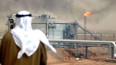 An employee of the Kuwait Oil Company looks at a Gathering Centre at the al-Rawdatain field, 100 kms north of Kuwait City, Ja...
