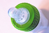 A baby bottle with teat