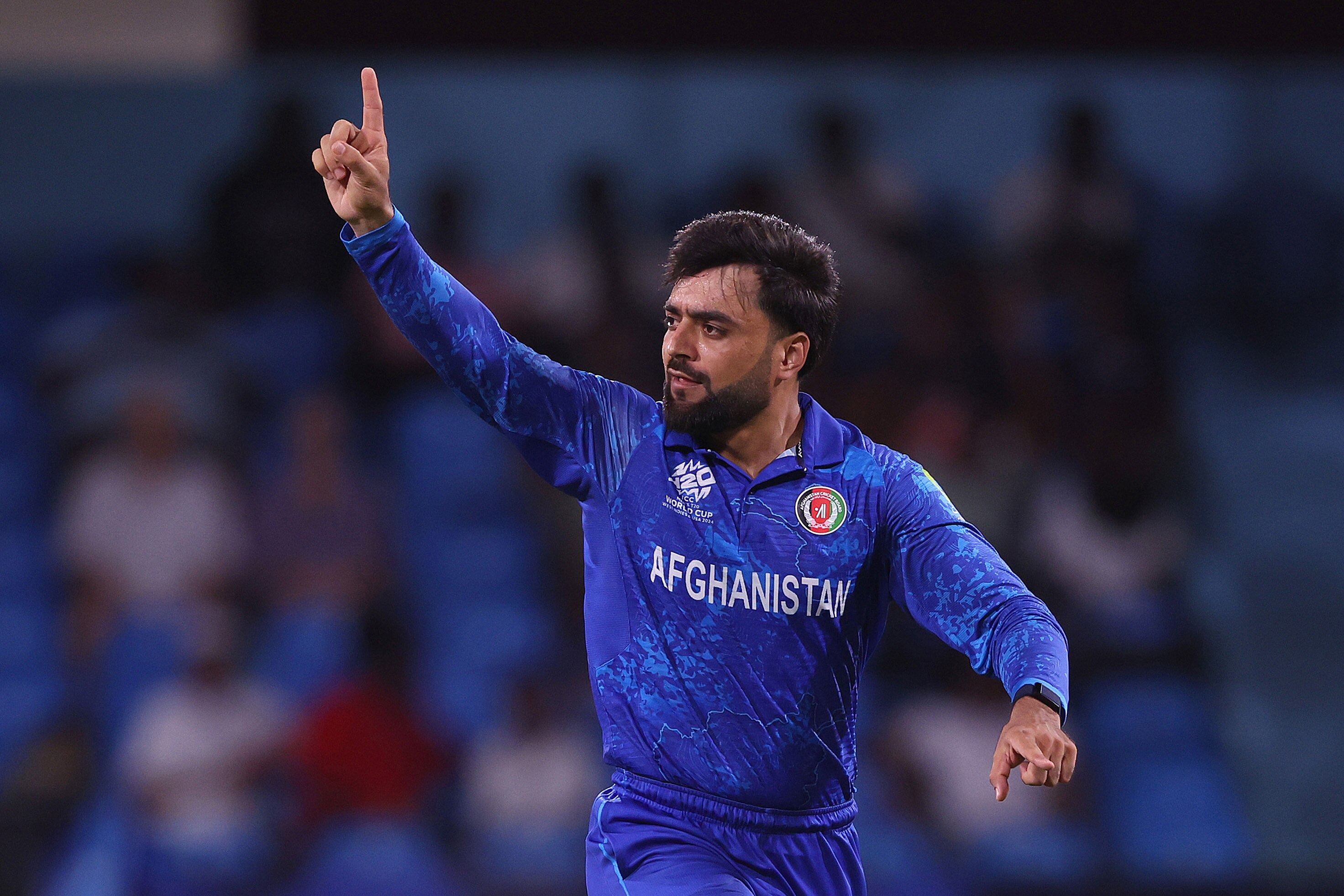 Afghanistan bowler Rashid Khan holds a finger up as he celebrates a wicket during a Twenty20 World Cup game against Bangladesh.