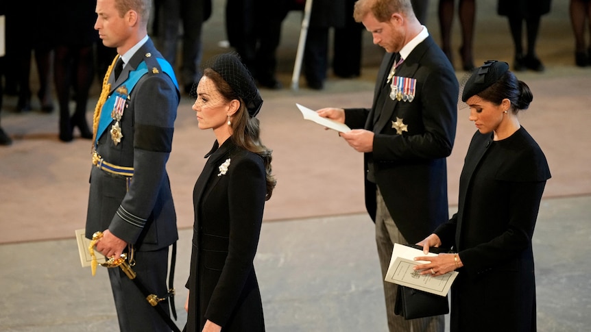 William, Kate, Harry Meghan stand together inside funeral. 