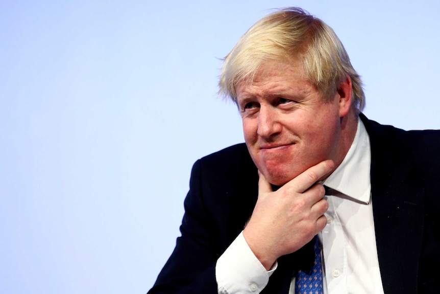 Britain's Foreign Secretary Boris Johnson sits with his hand on his chin