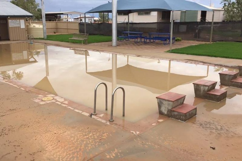 Birdsville pool brown and muddy after downpour.
