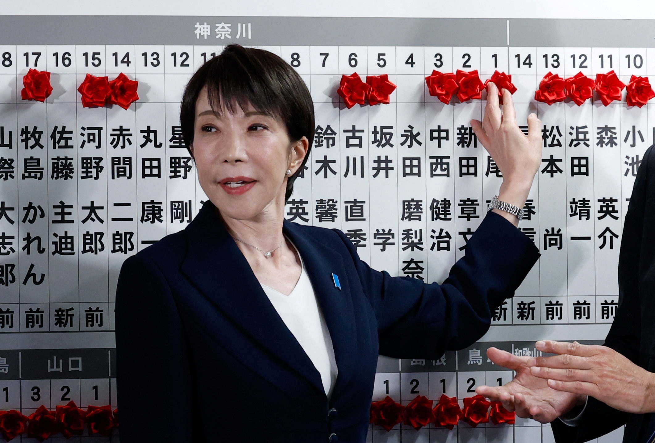 Japan's 'Iron Lady' leads coalition to landslide election victory