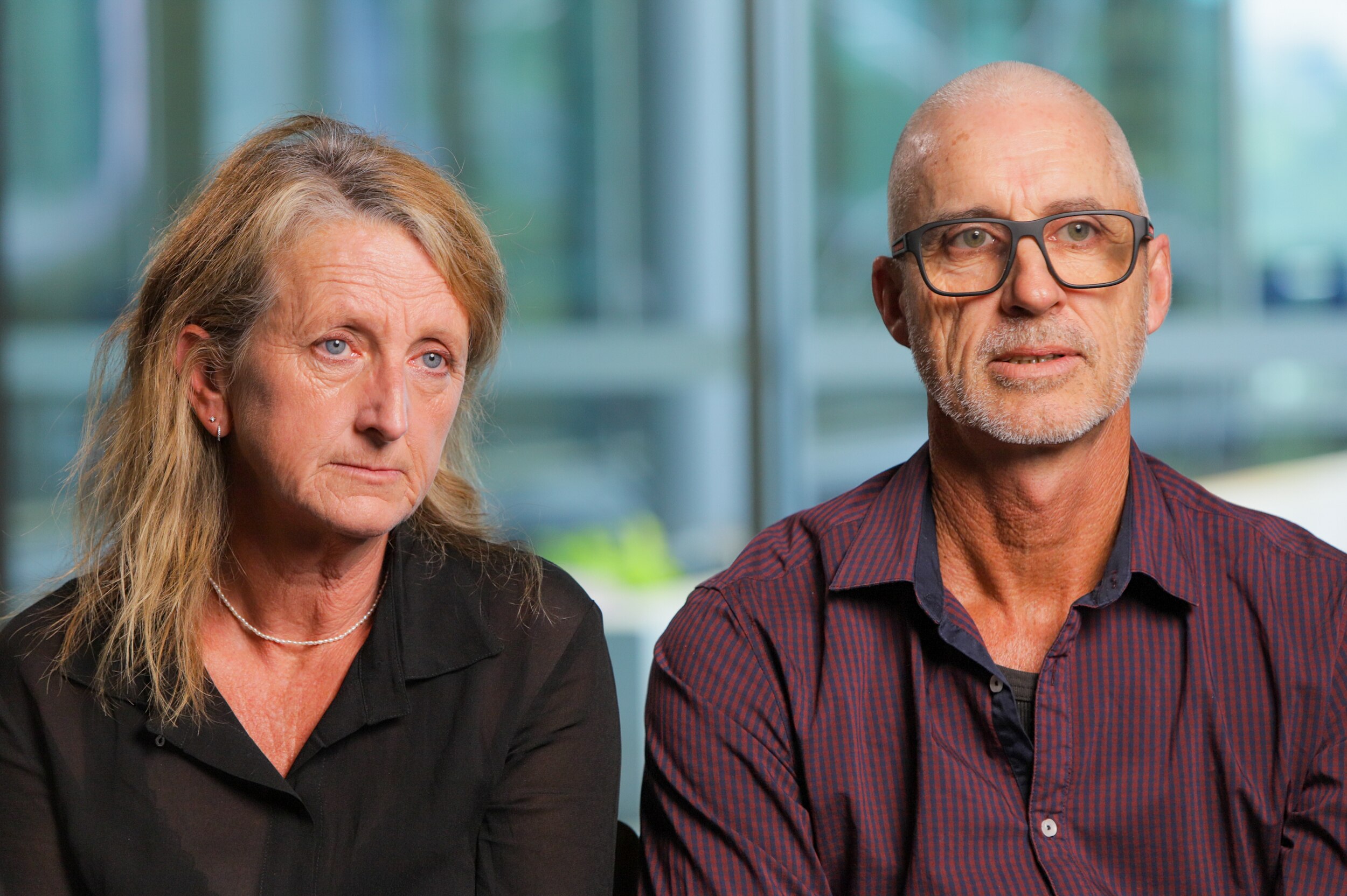 Michelle and Phil Dodunski sit shoulder-to-shoulder