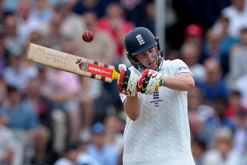 England batter Harry Brook closes his eyes as he swings his bat during an Ashes Test.