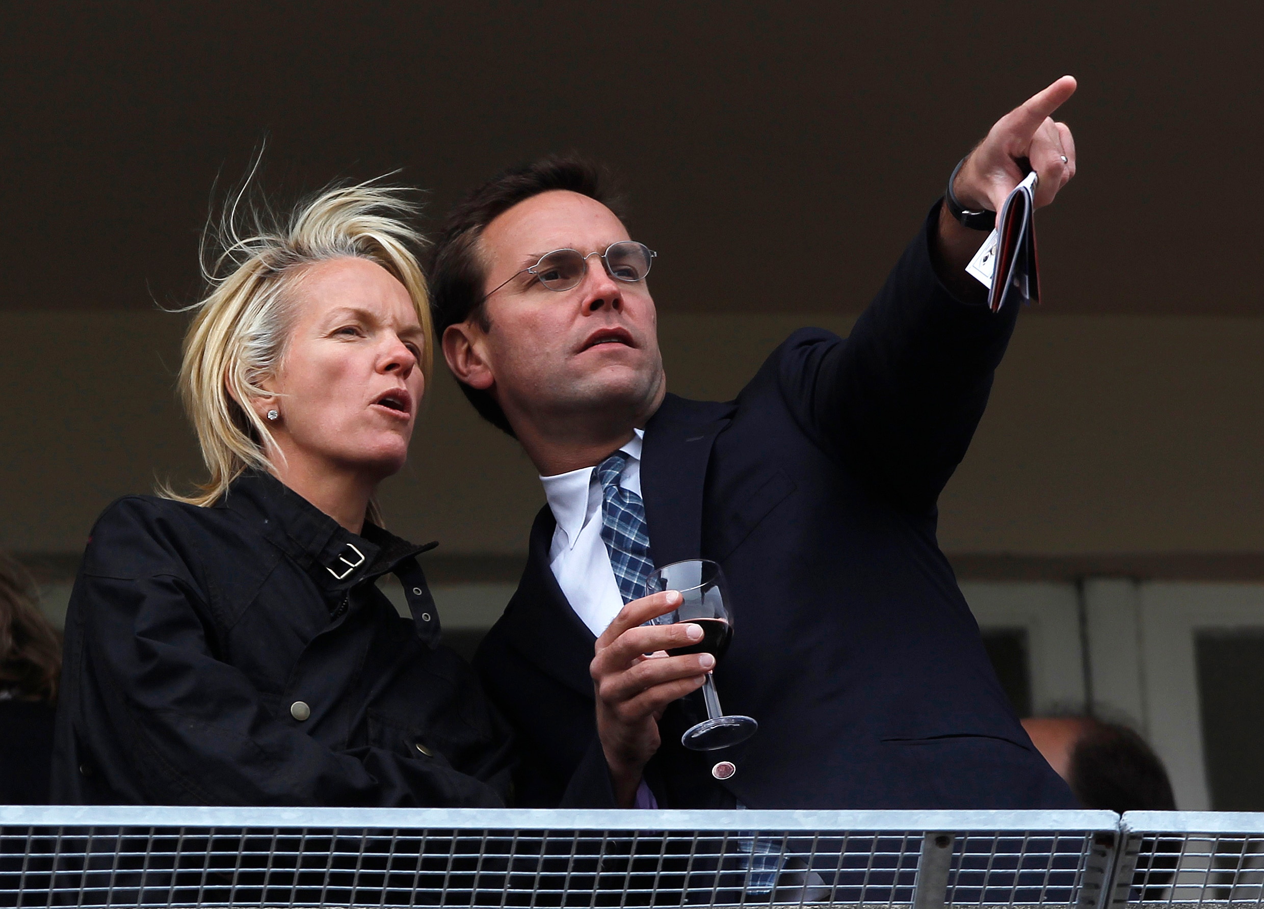 James Murdoch pointing something out to Elisabeth Murdoch