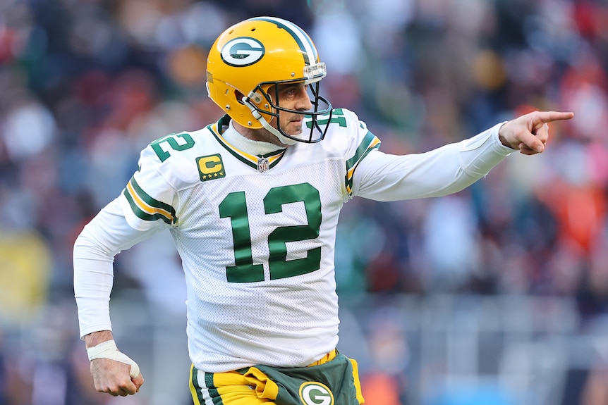 Aaron Rodgers points to one side