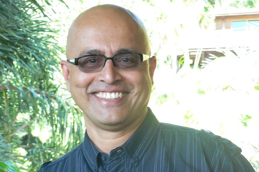 Dr Narayan Gopalkrishnan smiling at the camera