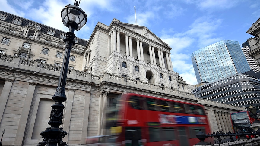 A bus passes the Bank of England in the City of London.