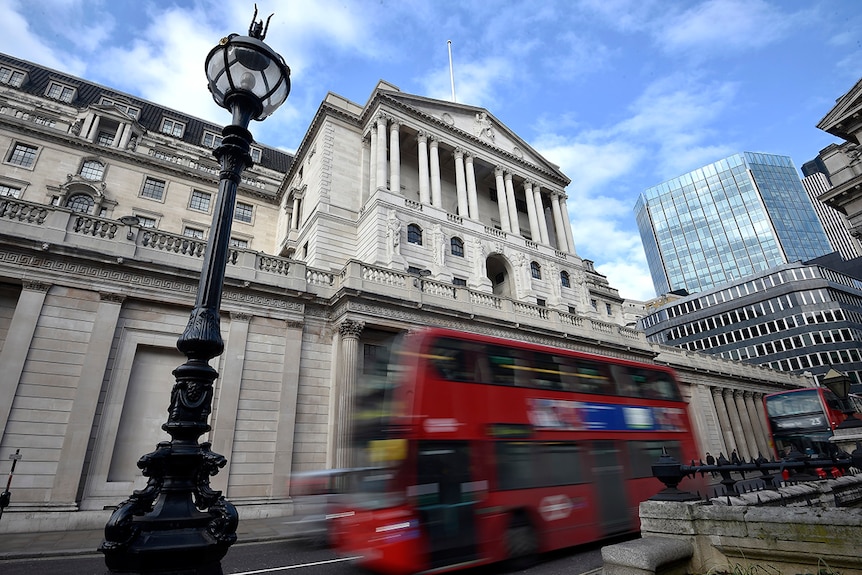 A bus passes the Bank of England in the City of London.