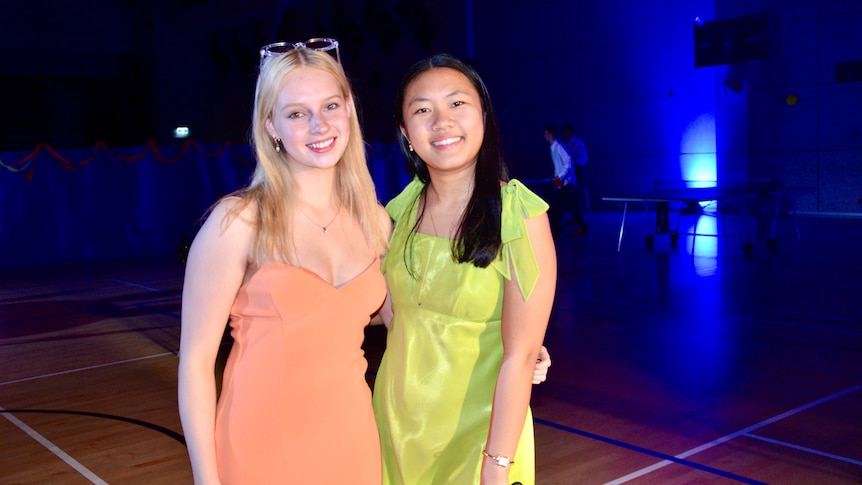 Two young women dressed beautifully for their formal