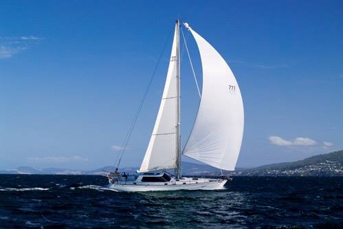 Image of the yacht Scarlet Ribbon under sail.