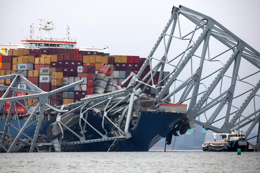 A view of the bow of the Dali cargo vessel that crashed into a bridge. Wreckage is strewn across the ship.