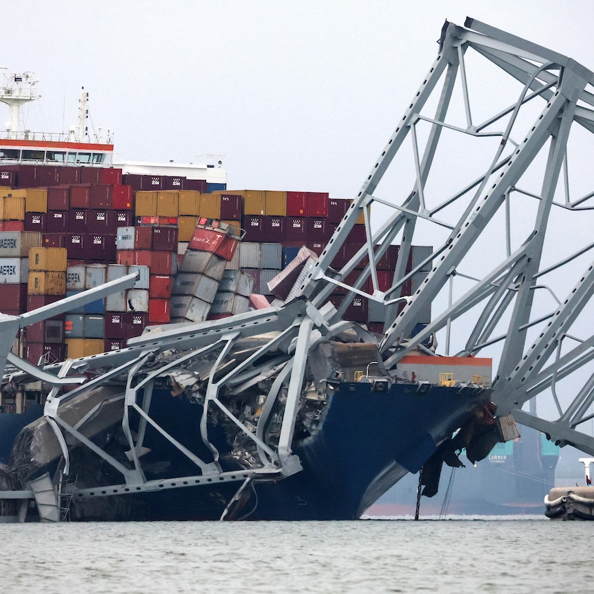 A view of the bow of the Dali cargo vessel that crashed into a bridge. Wreckage is strewn across the ship.