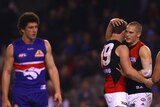 We needed that ... Bombers Heath Hocking and David Zaharakis celebrate a goal against the Bulldogs.