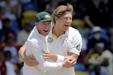 Michael Clarke and Shane Watson happy after Darren Sammy's wicket falls.