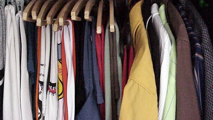 Shirts hang neatly in a wardrobe, July 2011.