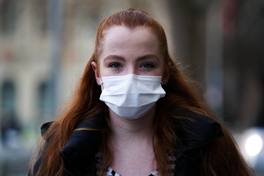 A woman in a face mask.