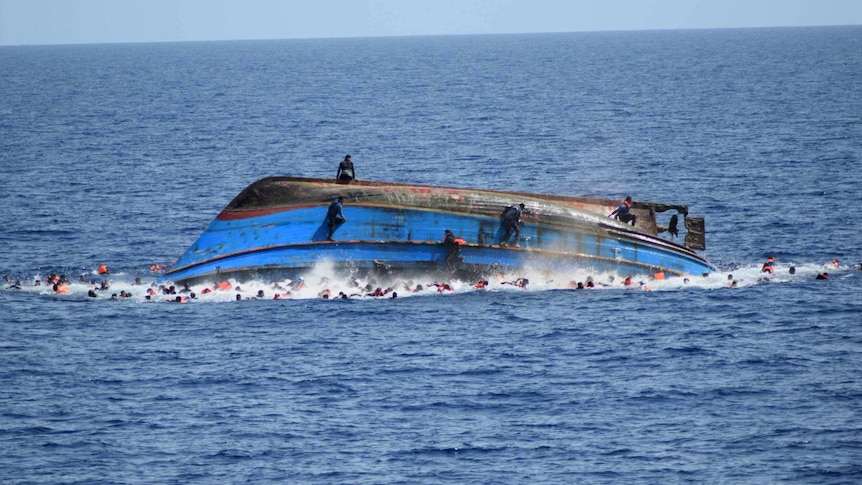 Hundreds in the water after overloaded boat capsized