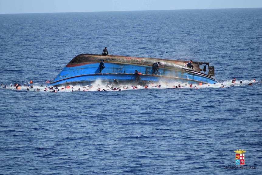 Hundreds in the water after overloaded boat capsized