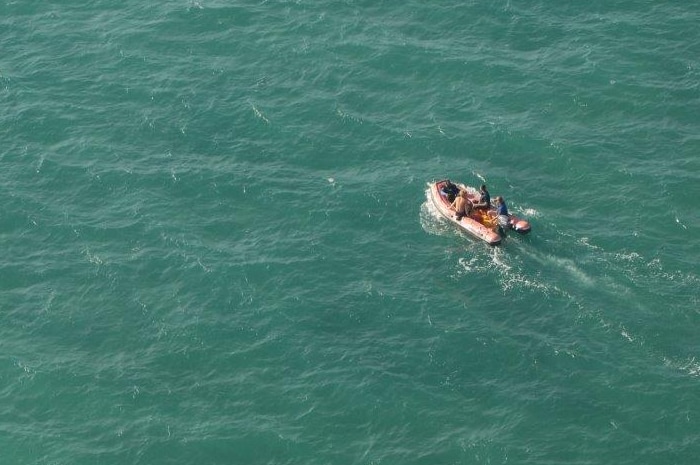 Two fisherman are transported from the navigation mast