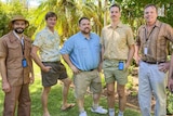 Five men dressing in 1980s clothing