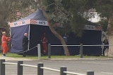 A police tent at a Brunswick West reserve where a man was found dead.