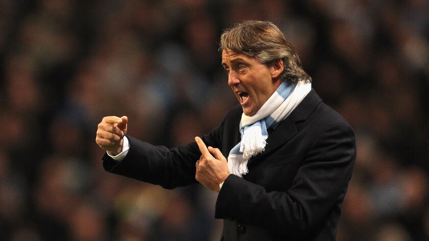 Down to the wire: Man City boss Roberto Mancini.