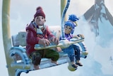 A still from the video game It Takes Two of characters May and Cody on a ski lift.