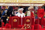 The Queen waves from the royal barge during the Thames Diamond Jubilee Pageant.