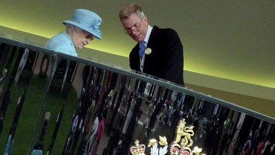 The Queen stands in the Royal Box at Royal Ascot.