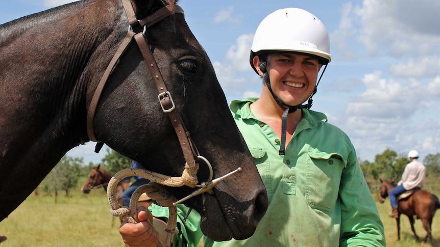 a man holding a horse