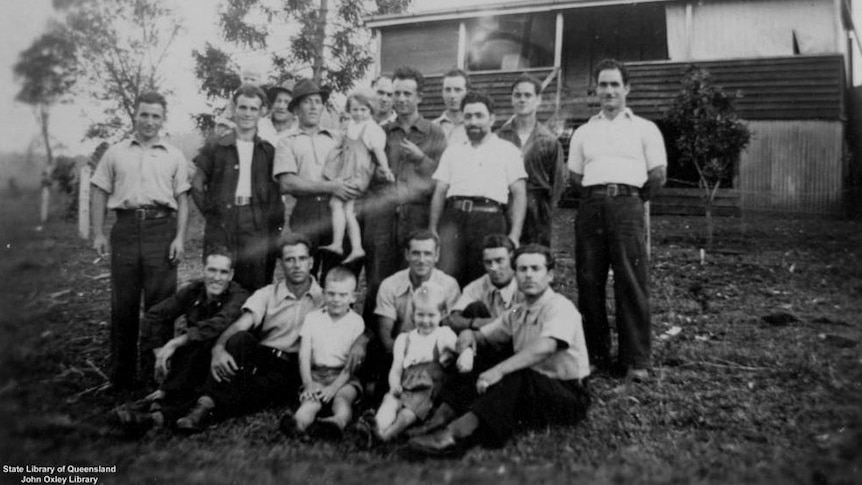 Black and white image from the 1940s a large group of men and children