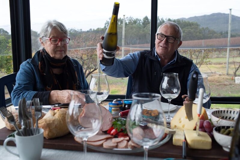 Duke and Hilde Ranson pour a glass of wine