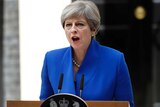 British Prime Minister Theresa May addresses the press from lectern in Downing Street