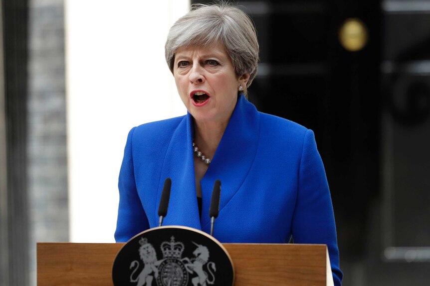 British Prime Minister Theresa May addresses the press from lectern in Downing Street