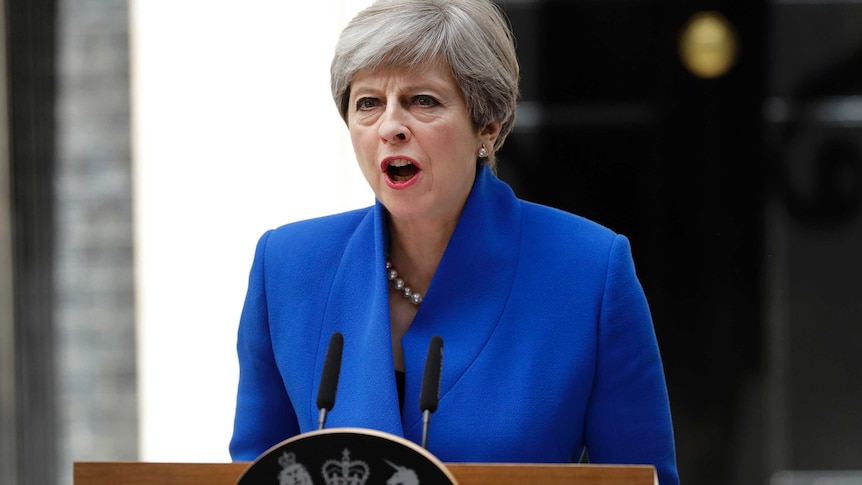 British Prime Minister Theresa May addresses the press from lectern in Downing Street