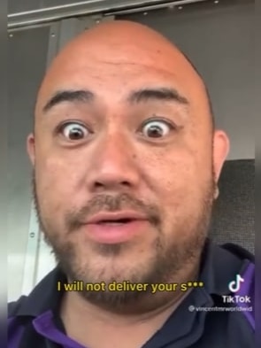 A bald man in a FedEx uniform