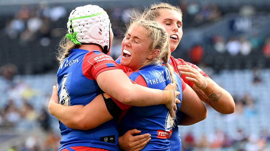 Three Knights players celebrate a try in the NRLW grand final.