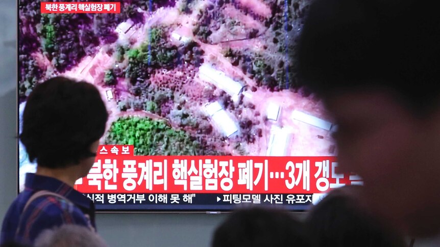 South Koreans watch TV news story about North Korean detonations