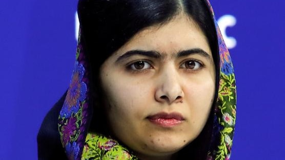 Malala Yousafzai listens during the World Economic Forum.
