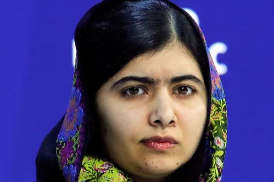 Malala Yousafzai listens during the World Economic Forum.