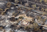 aerial view of neighbourhood burnt by bushfires