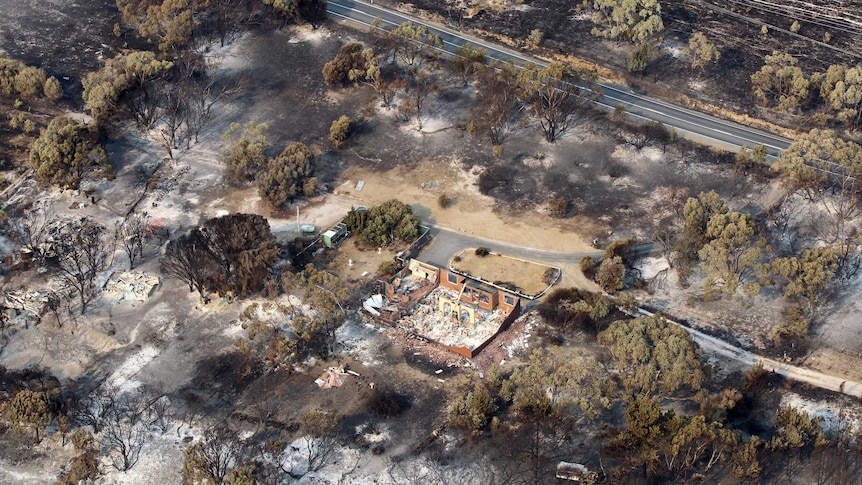 Homes damaged by bushfire seen from above between Dunalley and Boomer Bay, Tasmania