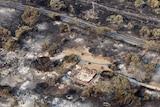 Homes damaged by bushfire seen from above between Dunalley and Boomer Bay, Tasmania